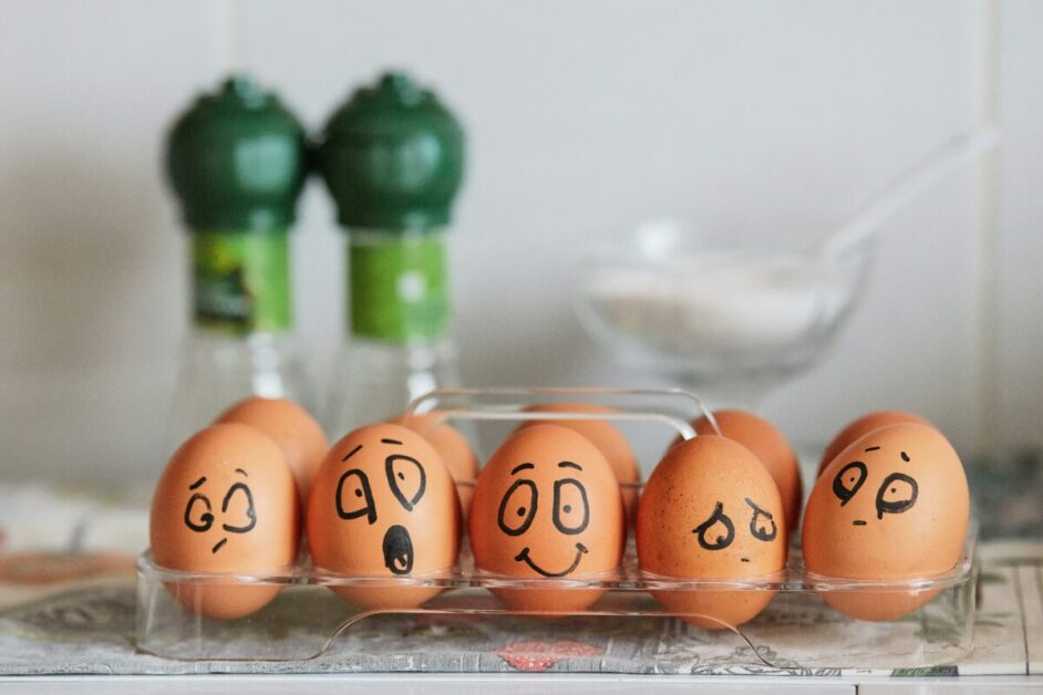 Eggs with expressive faces representing different emotions, symbolizing the importance of recognizing and managing emotions to boost emotional intelligence.