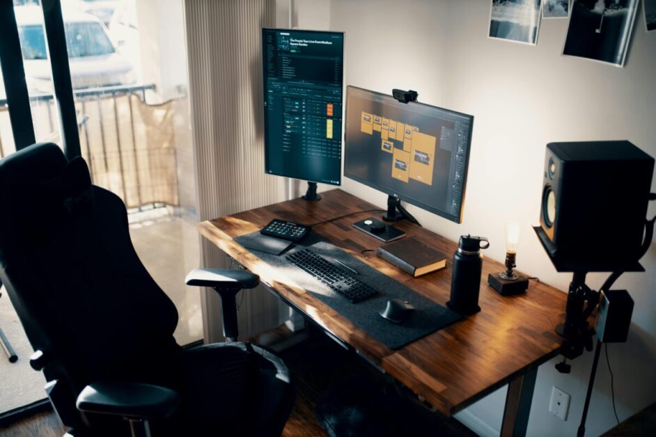 A well-organized workspace with a sleek gaming chair, dual monitors, and a minimalist setup. This image evokes a sense of productivity and focus, perhaps suggesting the importance of a clean and organized workspace for developing lasting habits.