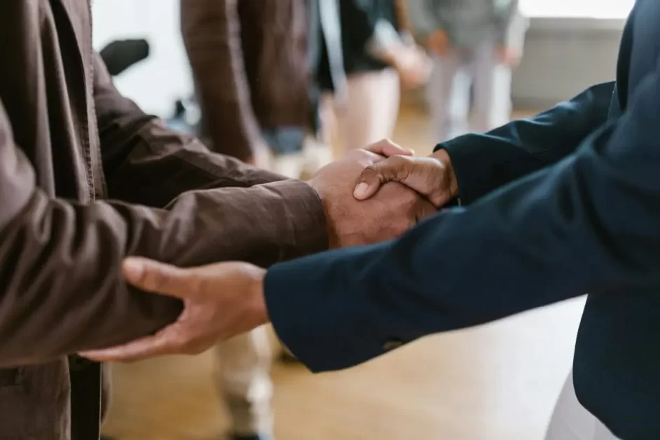 Entrepreneurial mindset captured through a handshake between two professionals, symbolizing collaboration, networking, and building partnerships.